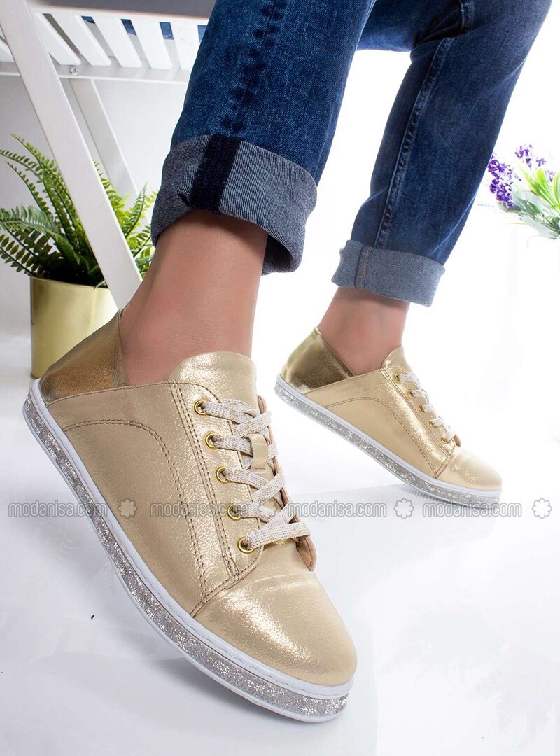 gold sport shoes