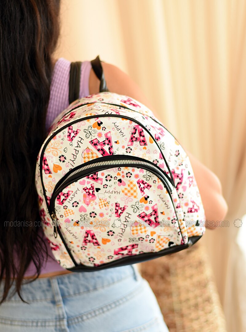 white and pink backpack