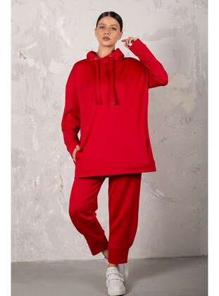 Melike Tatar Red Suit
